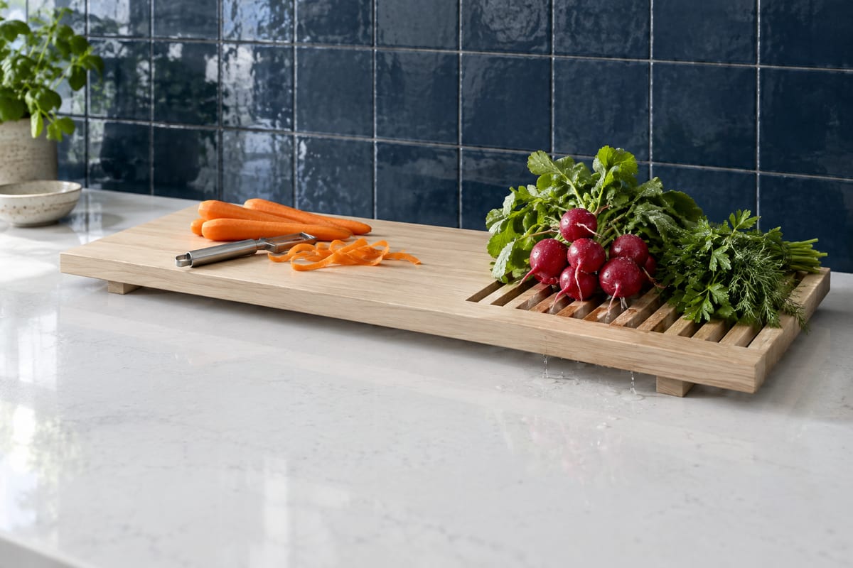 Over-the-sink board with a drain grate, a rendering